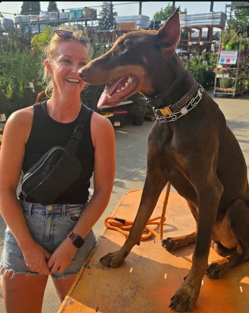 Cooper and his handler during a Home Depot training visit